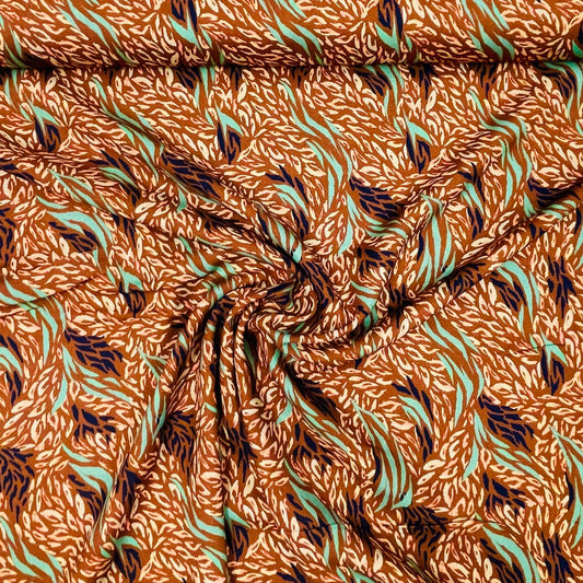 100% viscose fabric, brownish with a mint pattern 125 g/m²