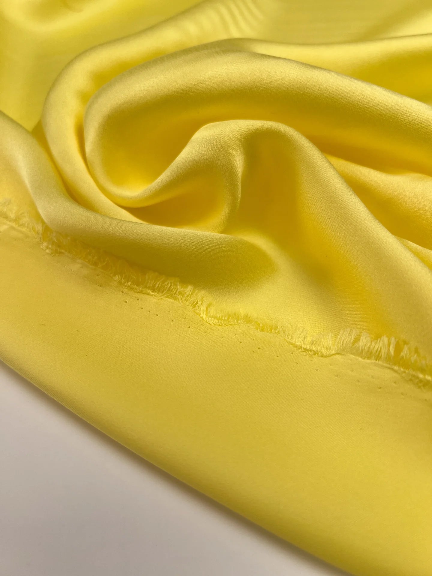 100% silk satin fabric in yellow – Italy, with a small defect