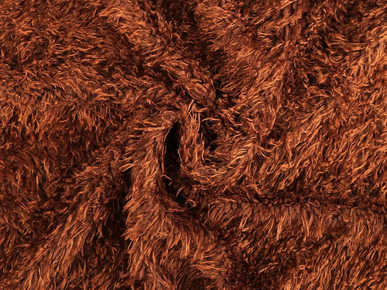 Soft plush faux fur fabric in orange-brown, 1 m pack – available online at Charlotte's Fabrics