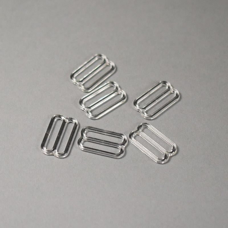 Régulateur en plastique pour linge 18 mm - transparent (lot de 10 pièces)