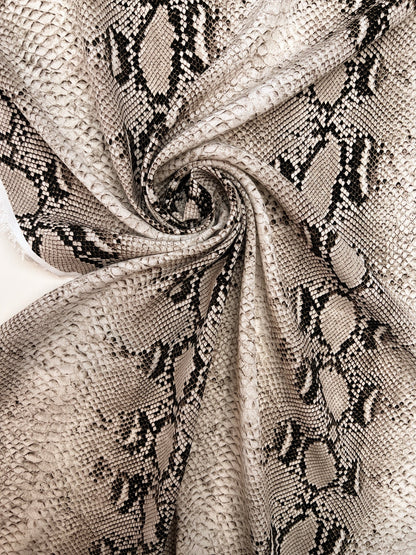 Viscose crepe fabric with snakeskin pattern in beige tones – Italy