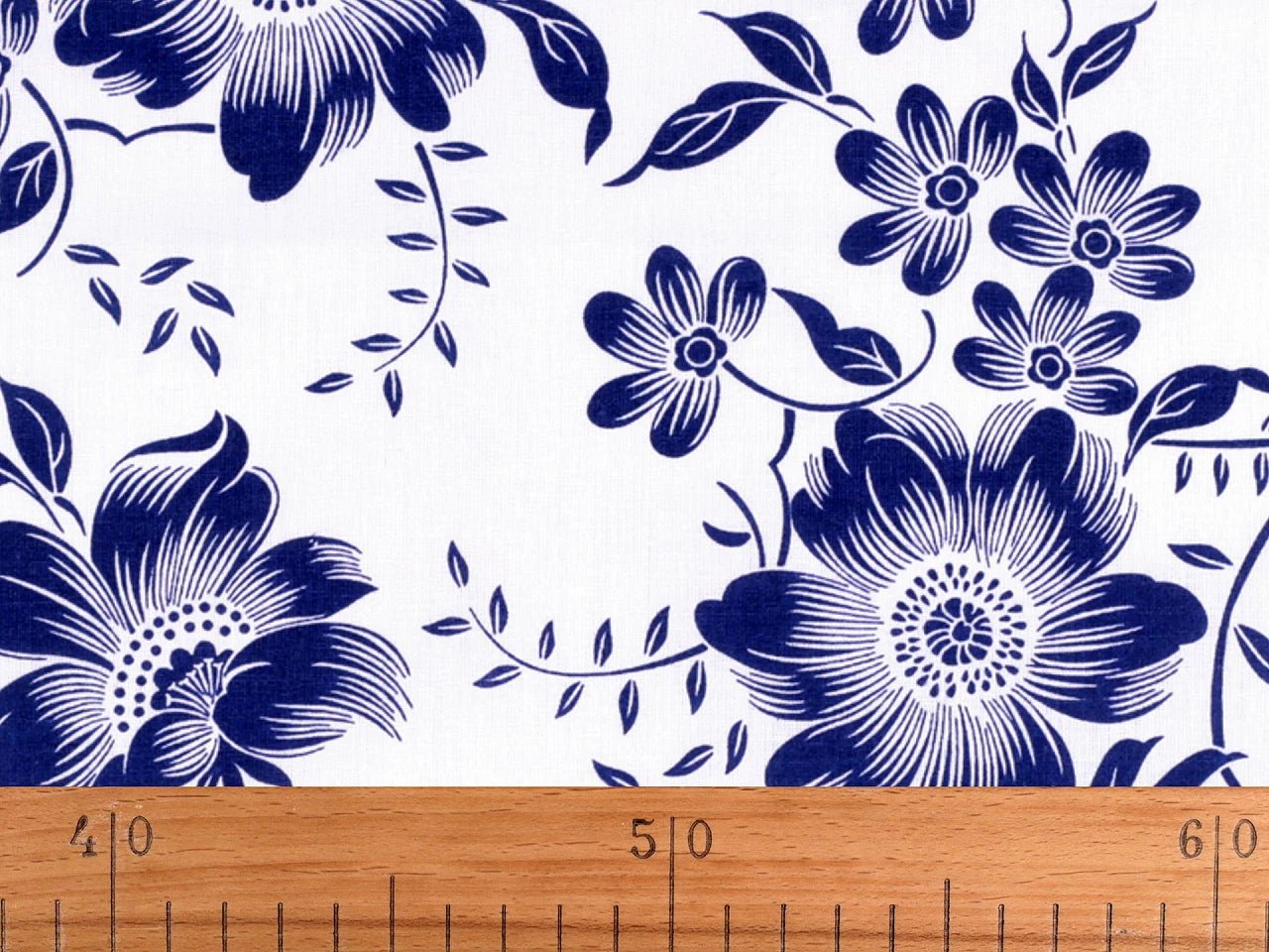 Image with 100% cotton fabric - white flowers on blue 125 g/m² – available at Šarlotes audumi