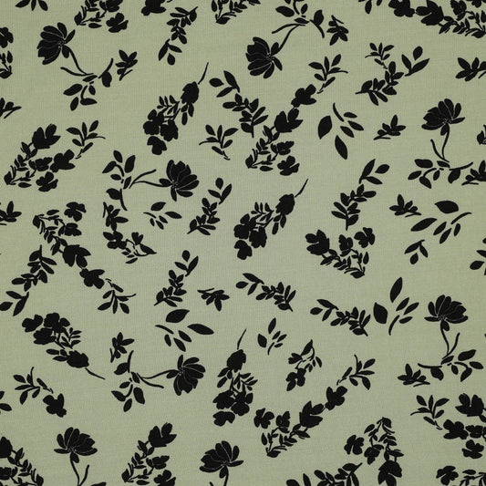Image of 100% viscose fabric with white flowers on a pistachio green background, 110 g/m² – available at Šarlotes audumi