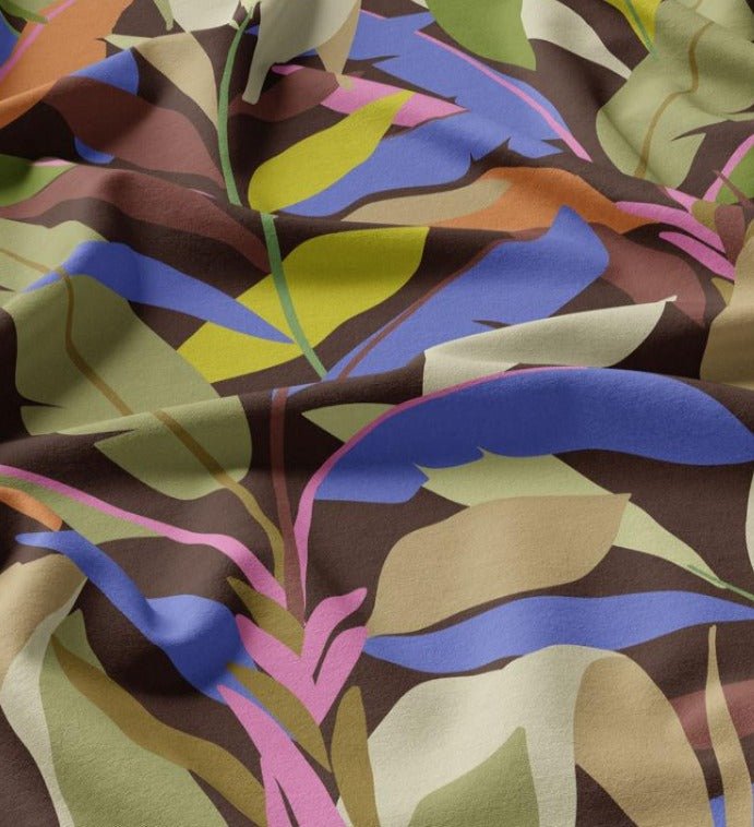 Image of 100% viscose fabric - bright tropical leaves 125 g/m² – available at Šarlotes audumi