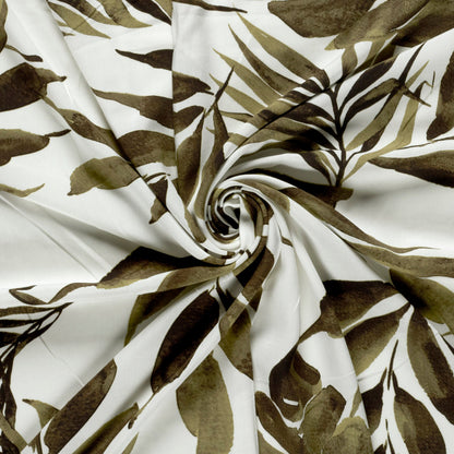 Image de tissu 100 % viscose - feuilles vertes sur fond blanc 125 g/m² – disponible chez Šarlotes audumi