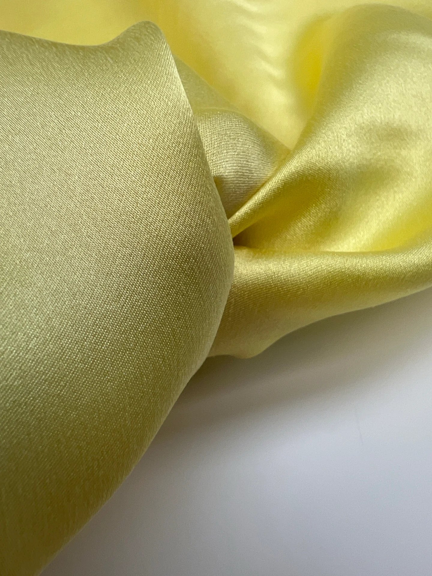 100% silk satin fabric in yellow – Italy, with a small defect