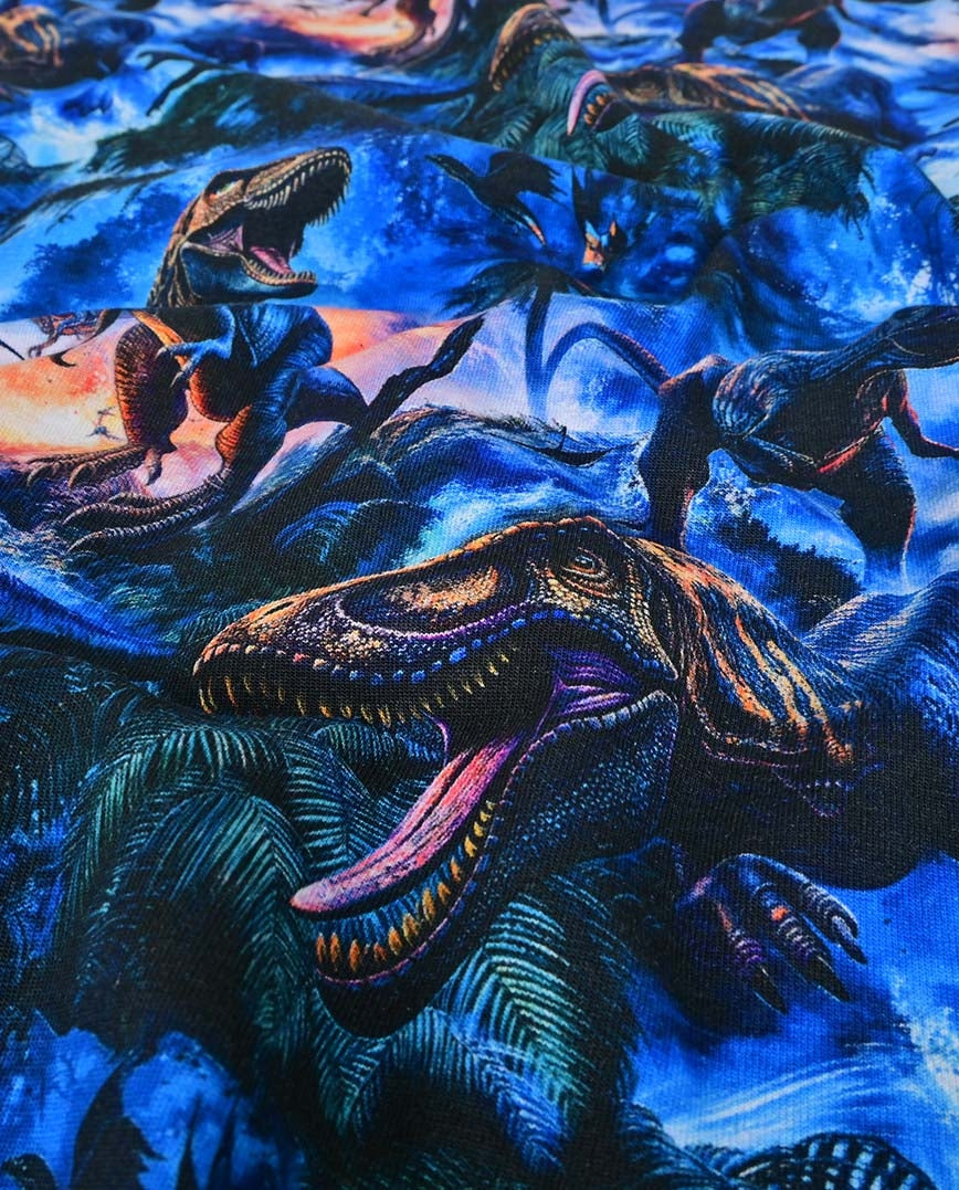 Puuvillajersey, dinosauruskuvio tummansinisellä