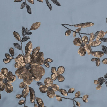 Image of flexible satin fabric with floral embroidery and sequins in blue, black and gold, available online at Šarlotes audumi