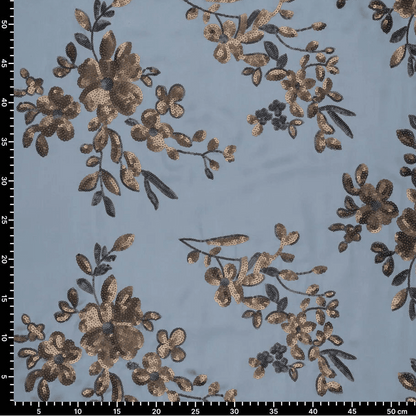 Image of flexible satin fabric with floral embroidery and sequins in blue, black and gold – available online at Charlotte's Fabrics