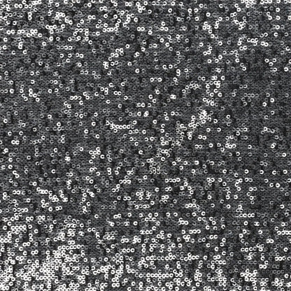 Image d’un tissu à sequins noir et argent 285 g/m² – disponible chez Šarlotes audumi