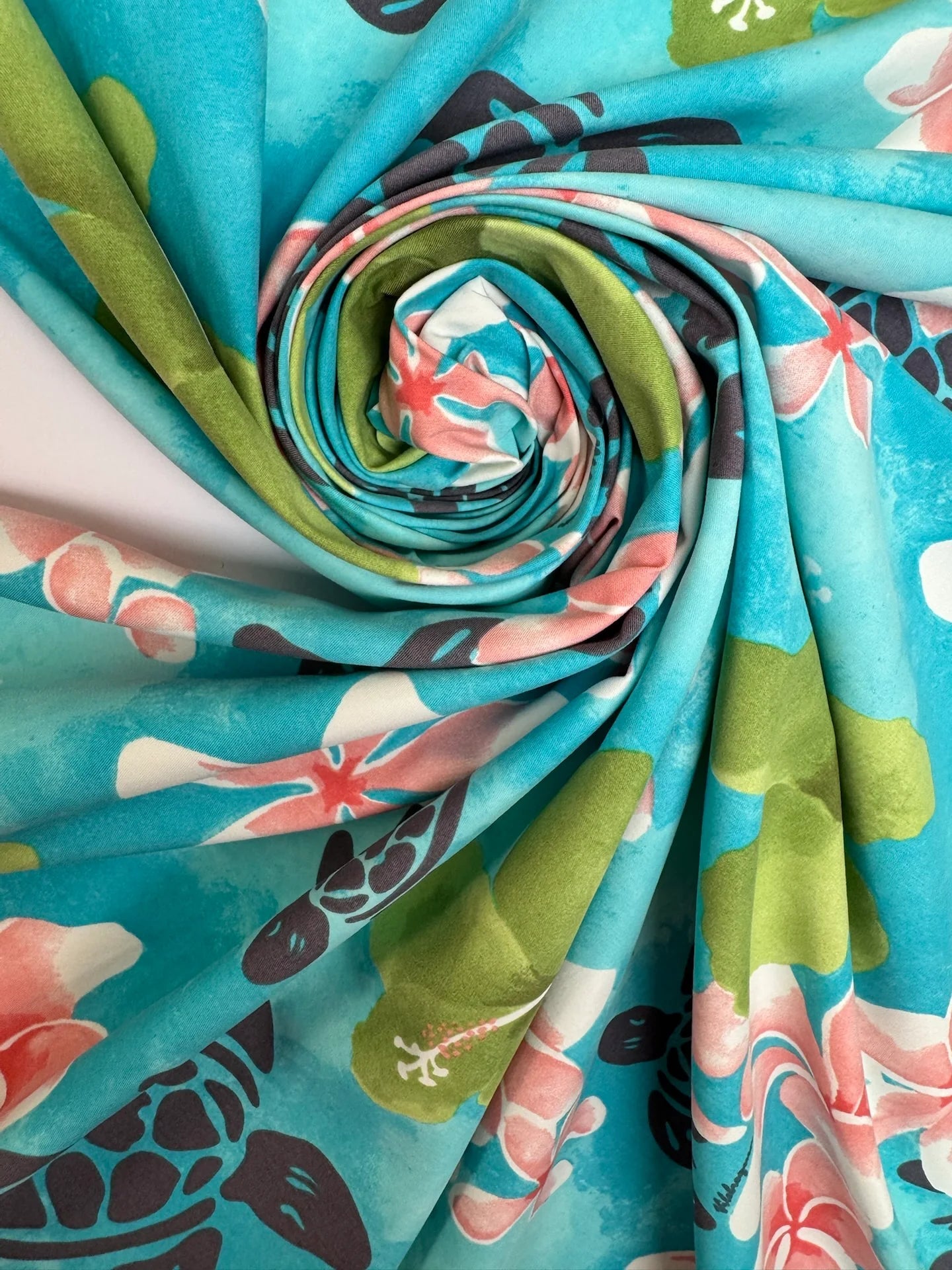 French fabric with a tropical floral pattern in teal shades - available online at Charlotte's Fabrics
