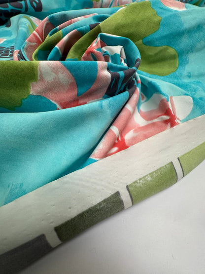 French fabric with a tropical floral pattern in teal tones – available online at Charlotte's Fabrics