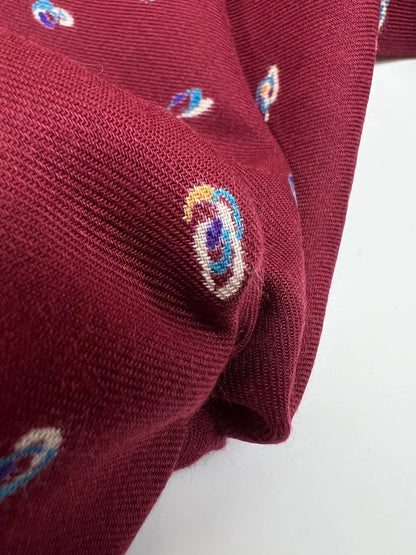 Image of Italian twill fabric in burgundy with a subtle pattern – available online at Šarlotes audumi