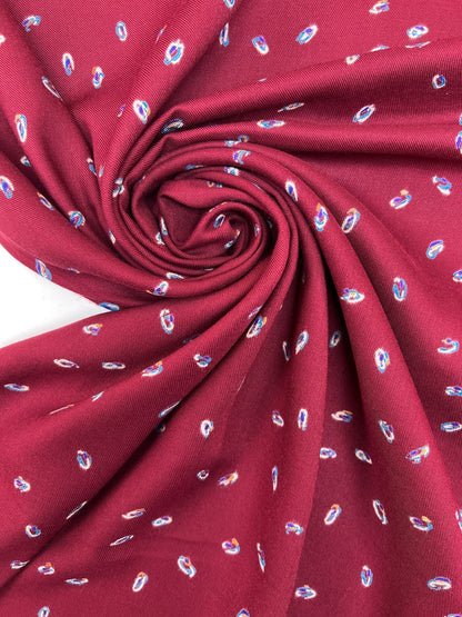 Image of Italian twill fabric in burgundy with a subtle pattern – available online at Šarlotes audumi