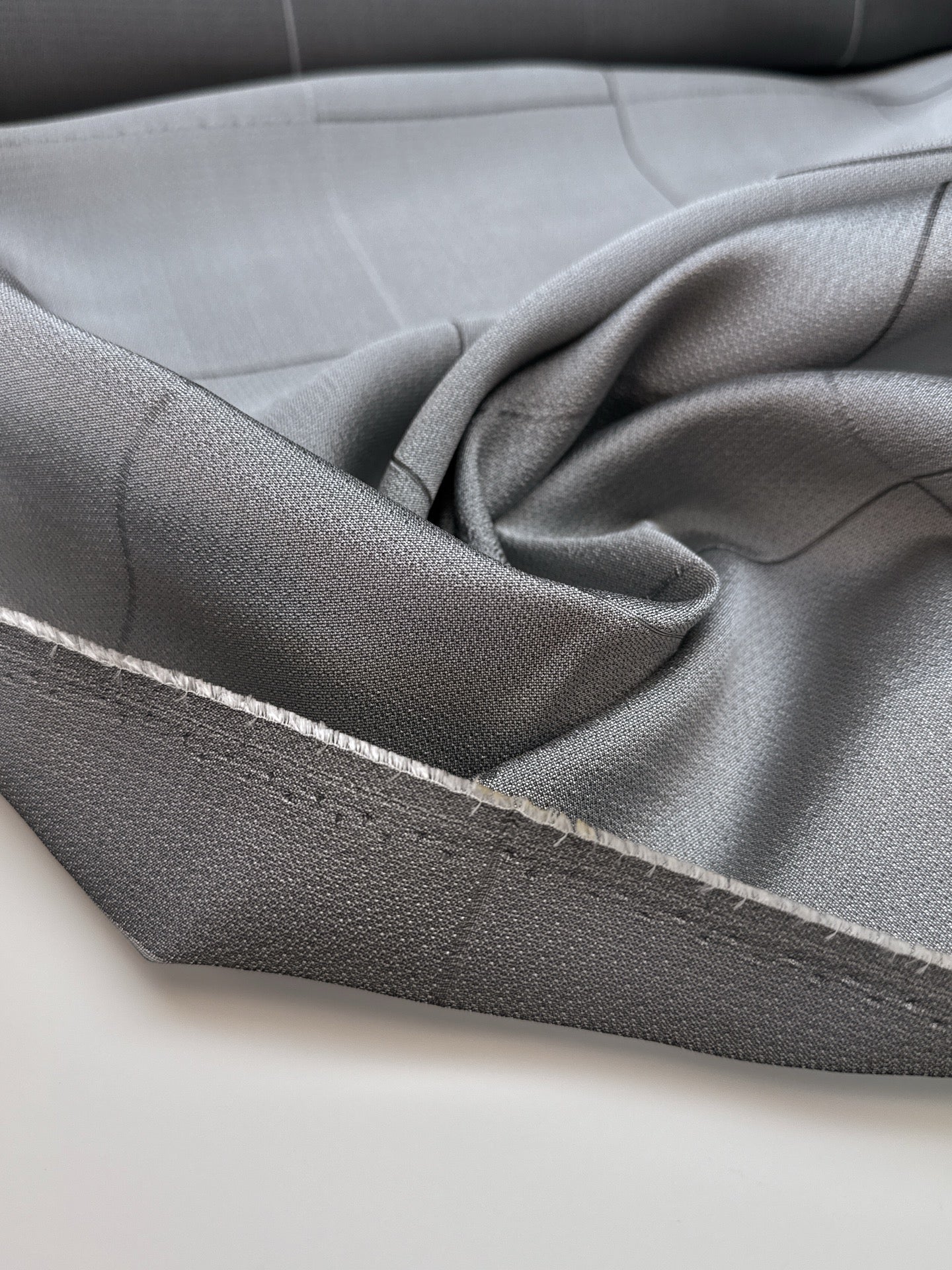 Image of Italian viscose and silk fabric in a gray check pattern – available online at Charlotte's Fabrics