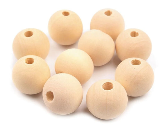 Image with wooden beads Ø18 mm | Natural, untreated wood – available at Charlotte's Fabrics
