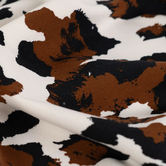 Image of cotton loop-knit with insulation - cow pattern 230 g/m² – available at Charlotte's Fabrics