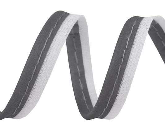 alt
Image with cotton ribbon, edging ribbon with cord 10 mm - reflective – available at Charlotte's Fabrics