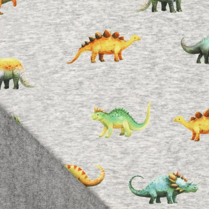 Kuva puuvillaisesta vuoratusta trikoota | Alpen fleece-dinosaurukset harmaalla – saatavilla verkossa Šarlotes audumi