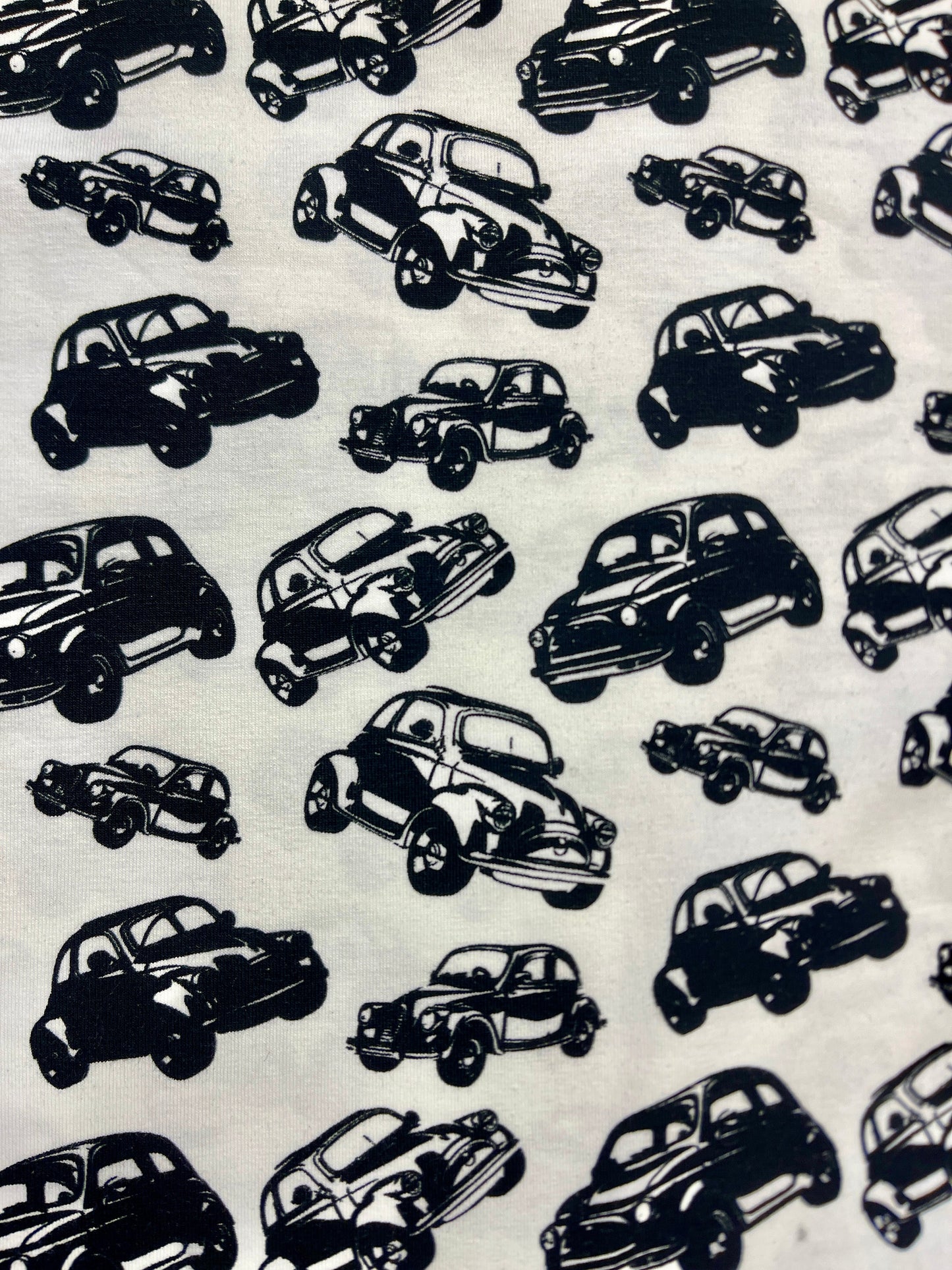 Cotton knit fabric - black cars on a white background 200 g/m²