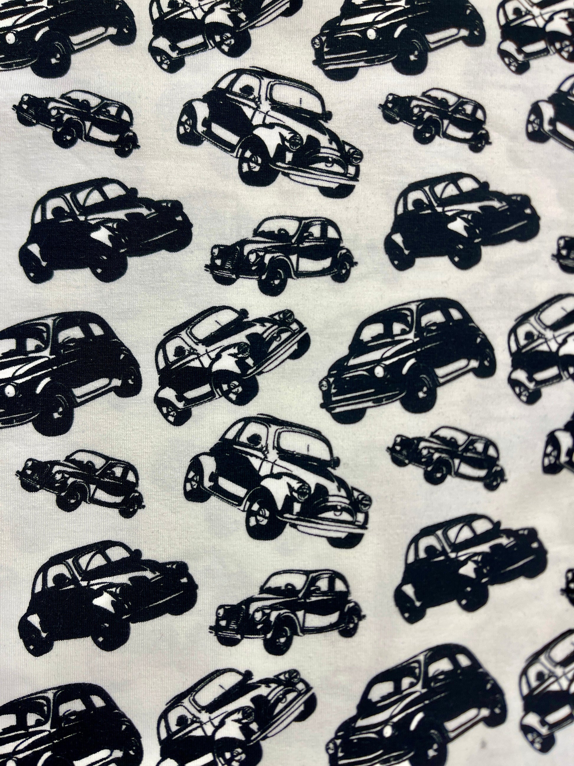 Cotton knit fabric - black cars on a white background 200 g/m²