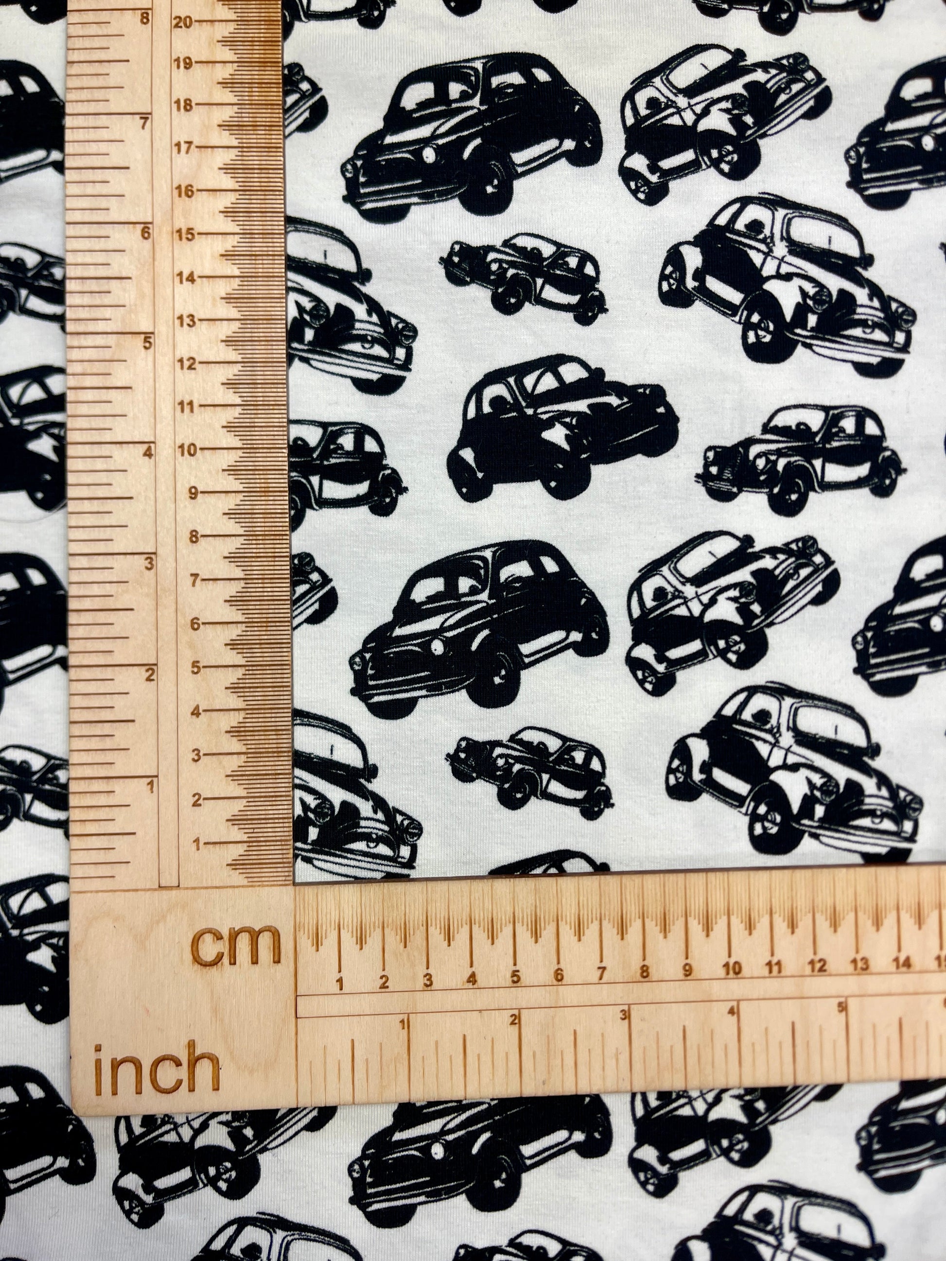 Cotton knit fabric - black cars on a white background 200 g/m²