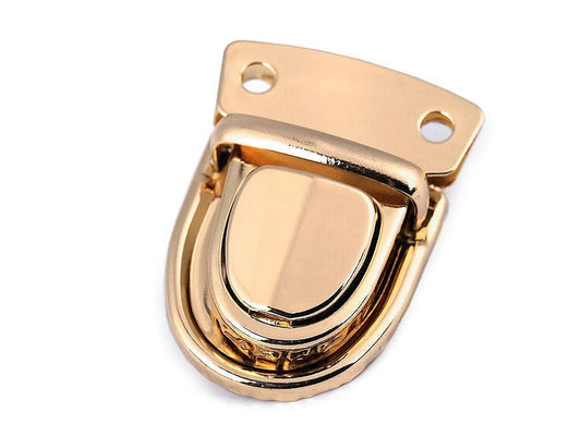 Kuva metallisesta laukkujen lukosta, 30 × 40 mm – kulta – saatavilla verkossa Šarlotes audumi