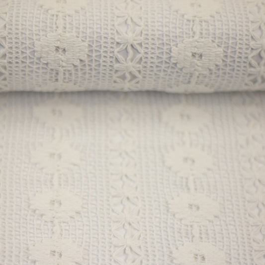 Image of lace fabric, warm white with a floral pattern – available online at Charlotte's Fabrics