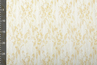 Tissu en dentelle fin avec doré - noir 90 g/m²