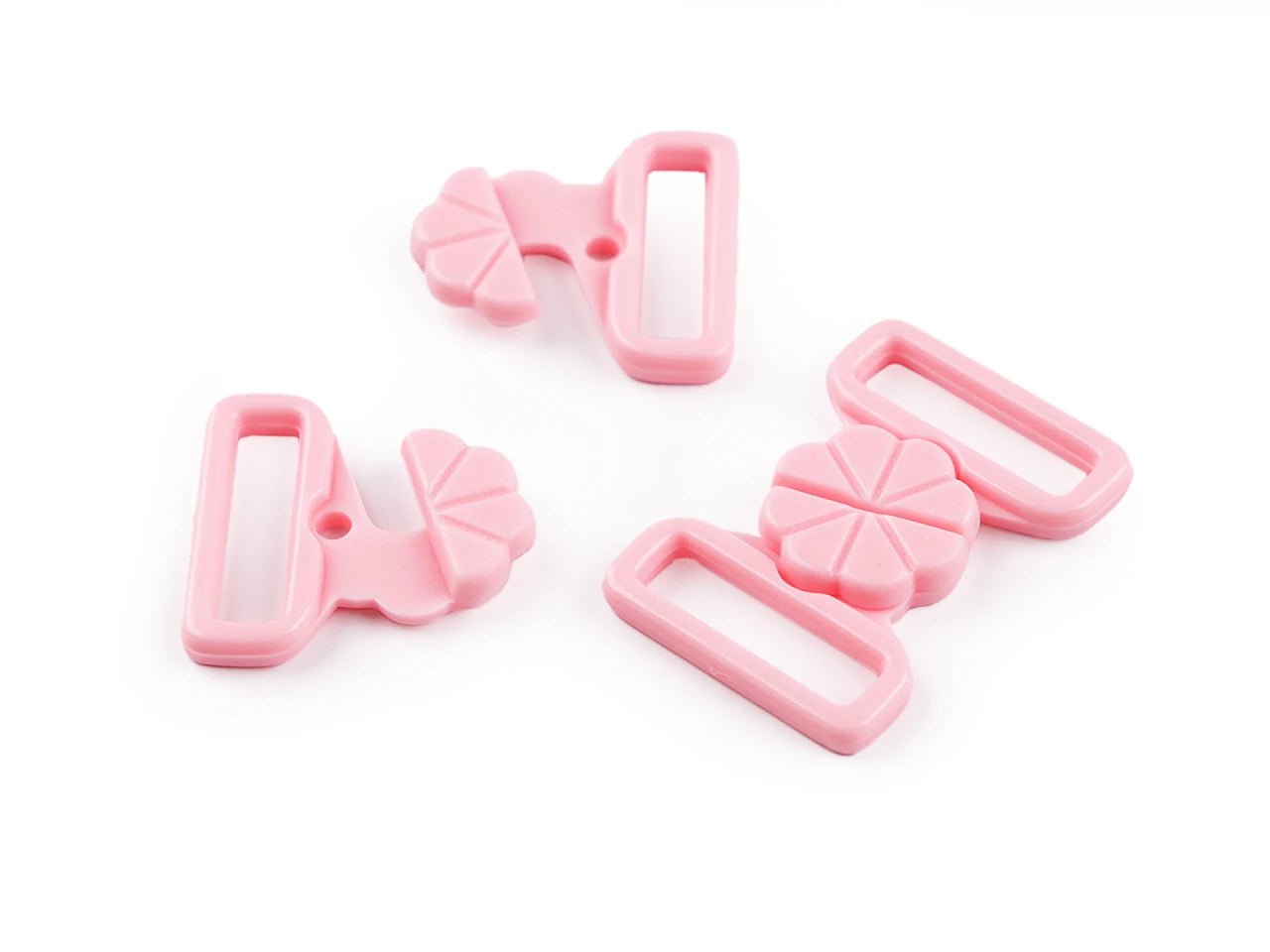 Image with plastic fasteners for swimsuits – 17 mm, 5 pairs – available at Charlotte's Fabrics