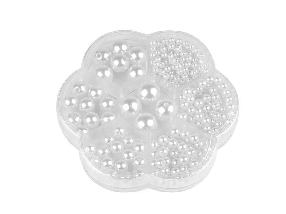 Image of a plastic bead set – in a flower-shaped box – available at Šarlotes audumi
