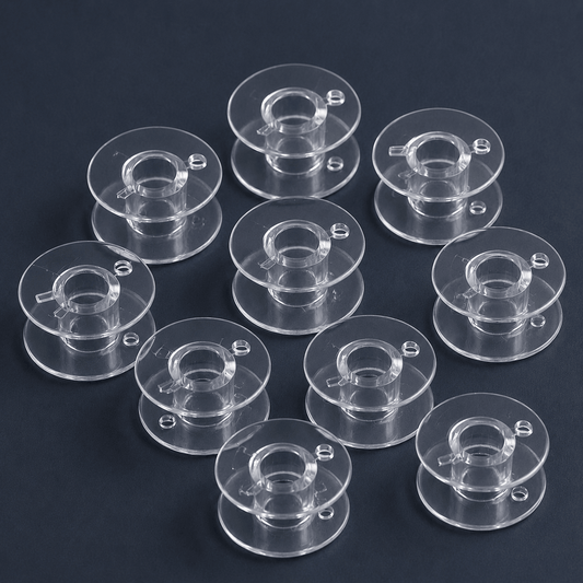 Attēls ar Plastmasas spolīte plakana šujmašīnām Ø 20,4 mm-komplekts 10 gab. – pieejams internetā Šarlotes audumi