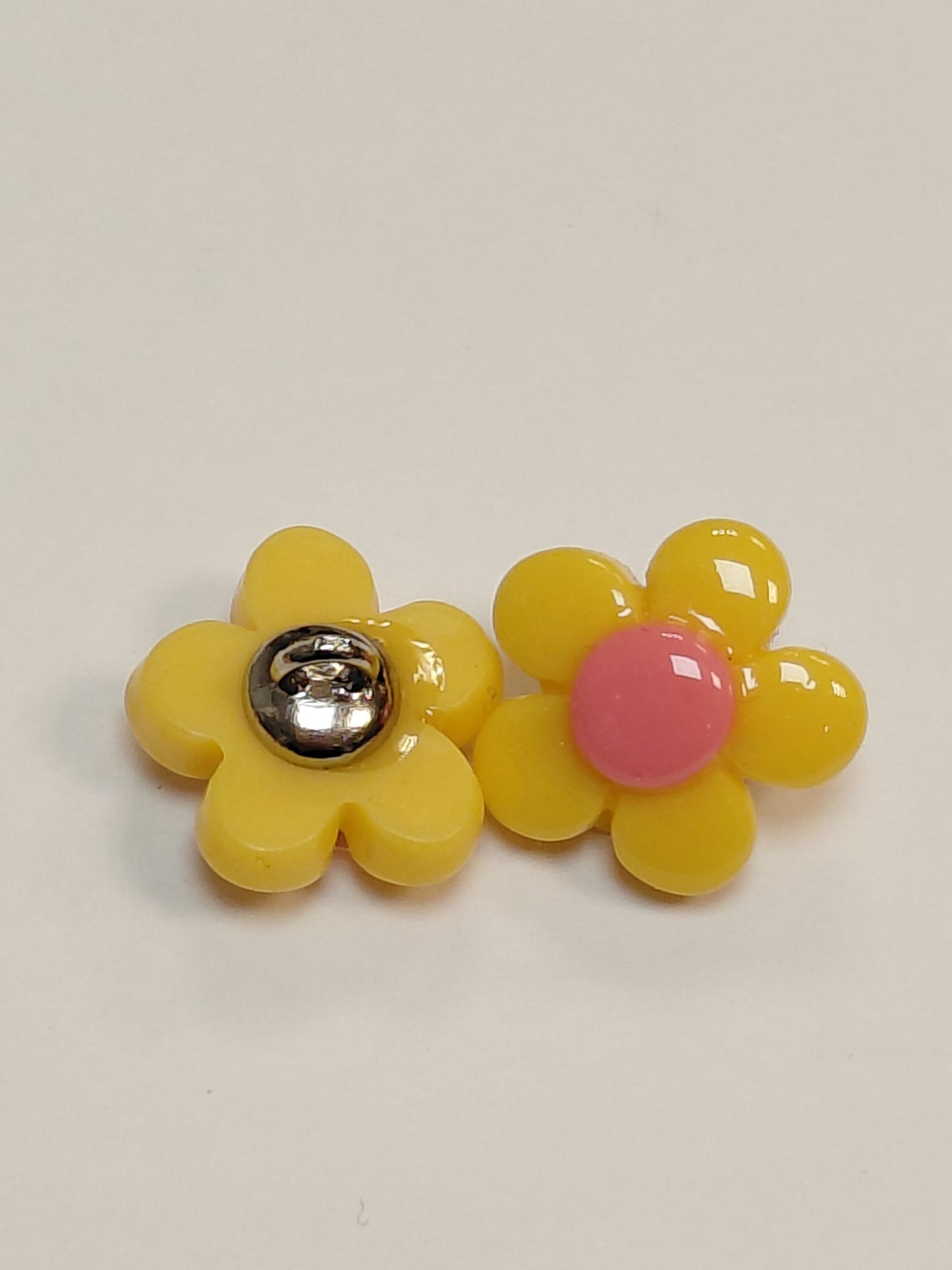 Image of a 14 mm shank button - yellow flower – available at Charlotte’s Fabrics