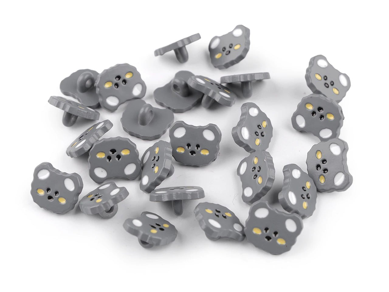 Image with 15 mm cat-shaped button on a shank, assorted shades – available at Charlotte's Fabrics