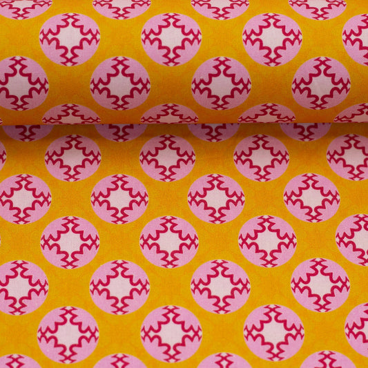 Image of premium cotton fabric - retro pink medallions on a saffron background, 130 g/m² – available at Šarlotes audumi