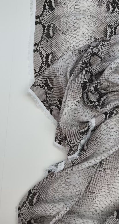 Viscose crepe fabric with snakeskin pattern in beige tones – Italy