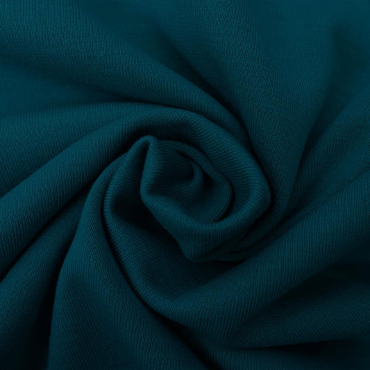 Image du tissu jersey Punta di Roma – pétrole 320 g/m² – disponible chez Šarlotes audumi