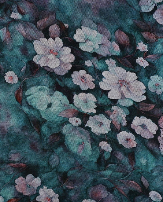 Image en tissu tricoté Punto di Roma à fleurs sur fond bleu-vert, 240 g/m² – disponible chez Tissus de Charlotte