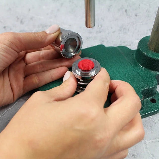 alt
Image with a hand press button-making tool – available at Charlotte Fabrics