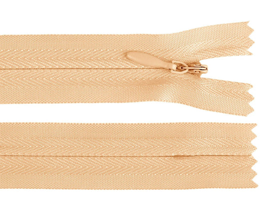 Image with hidden zipper - pastel orange – available at Charlotte’s fabrics