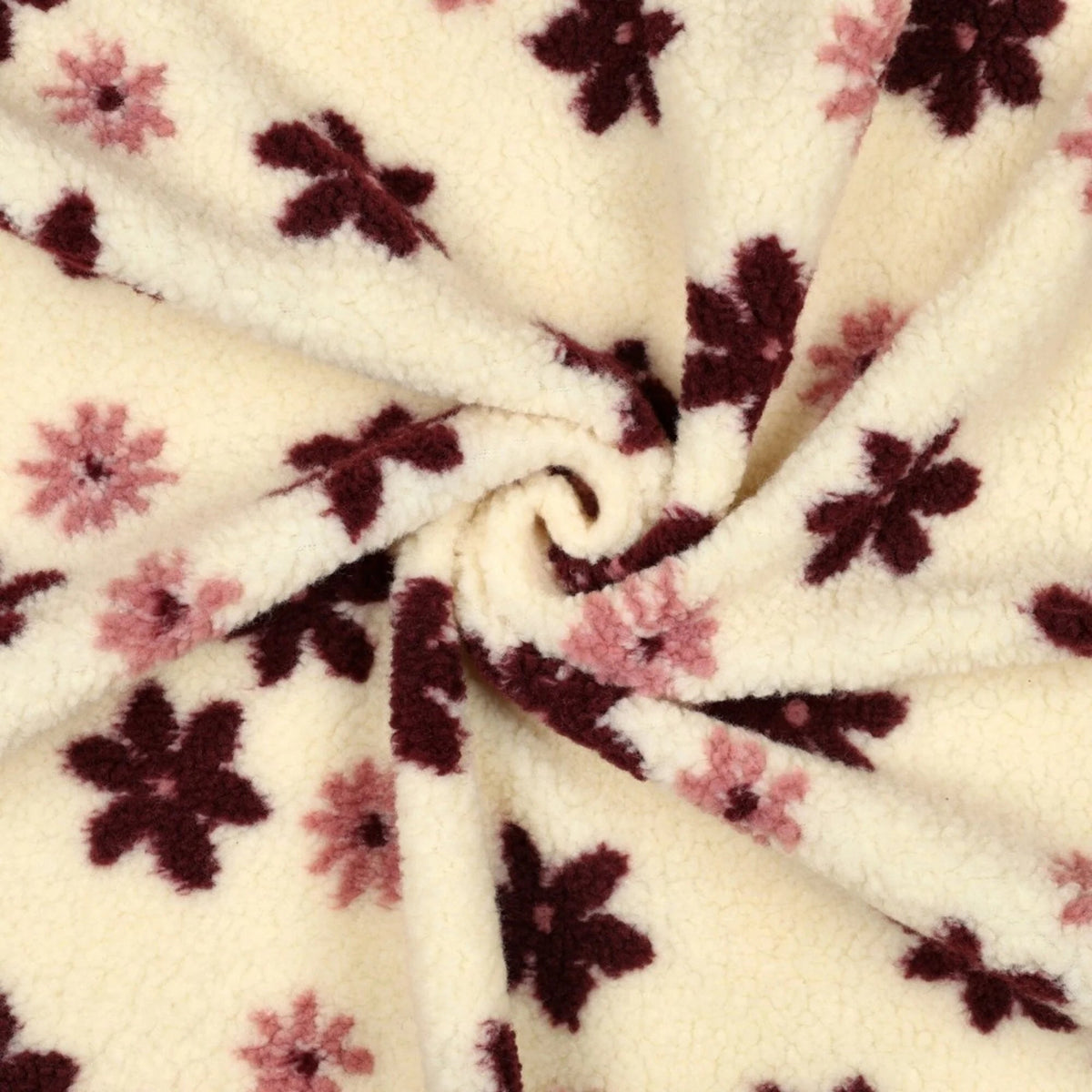 Kuva Teddy-fleece-kukista vaalealla taustalla – saatavilla verkossa Šarlotes audumi