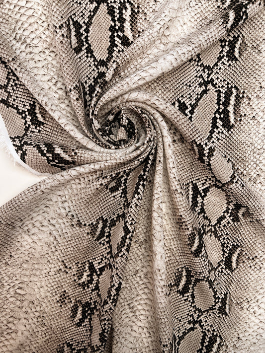 Image of viscose crepe fabric with snakeskin pattern in beige tones – Italy – available online at Charlotte's Fabrics