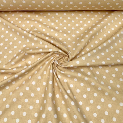 100% Baumwollstoff mit kleinen Punkten auf zartgelbem Hintergrund 125 g/m²
