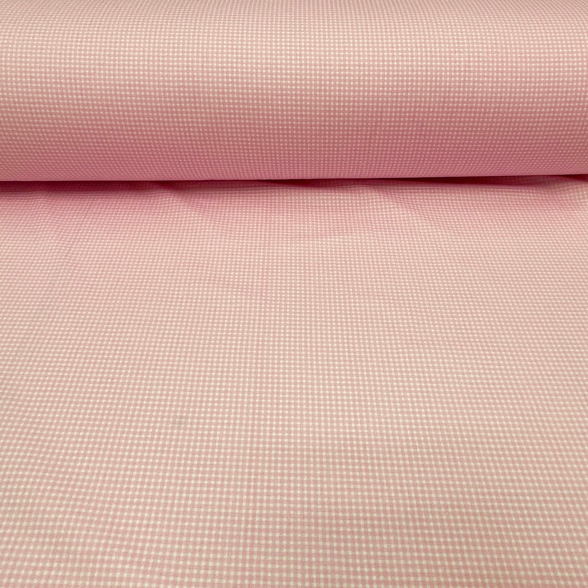 100 % puuvillakangas, hieno vaaleanpunaruudullinen 125 g/m²