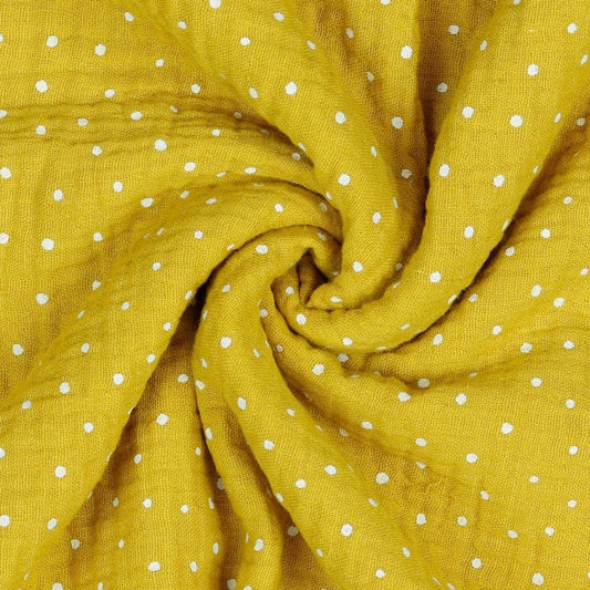 Mousseline à pois sur fond jaune miel 130 g/m²