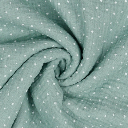 Mousseline à pois sur fond menthe foncé 125 g/m²